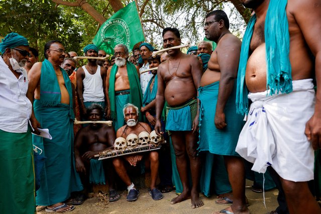 Farmers from the southern state of Tamil Nadu display skulls and bones, which they claim are the remains of the Tamil farmers who have died by suicide, during a protest demanding better crop prices and river interlinking from the government, at Jantar Mantar in New Delhi, India, on April 24, 2024. (Photo by Anushree Fadnavis/Reuters)