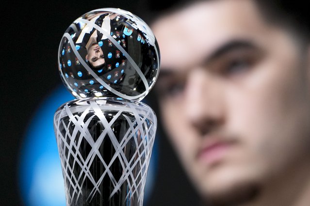 Purdue center Zach Edey, Associated Press Player of the Year, is seen in the trophy while speaking to the media during a news conference ahead of the Final Four college basketball games in the NCAA Tournament, Friday, April 5, 2024, in Glendale, Ariz. (Photo by David J. Phillip/AP Photo)