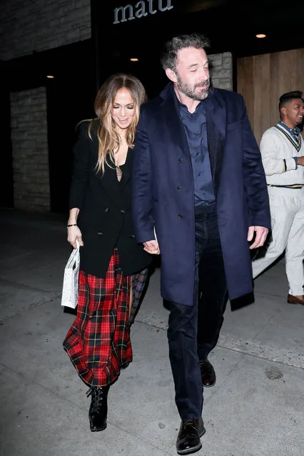 Jennifer Lopez and Ben Affleck are in good spirits after a romantic date night in Beverly Hills on January 31, 2022. The happy couple are seen hugging people goodbye as they walk towards their car to leave. (Photo by Backgrid USA)
