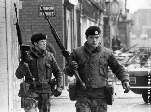 1972:  Armed British soldiers on patrol in Lisbon Street, Belfast, during the Official IRA's unconditional ceasefire