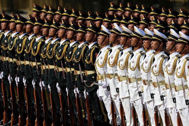 Honour guard members stand during a welcome ceremony for President of Equatorial Guinea Teodoro Obiang Nguema Mbasogo at the Great Hall of the People in Beijing, China on May 28, 2024. (Photo by Tingshu Wang/Pool via Reuters)