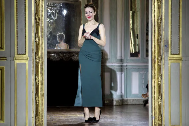 Fashion designer Ulyana Sergeenko acknowledges applause at the end of her fall-winter 2015/2016 Haute Couture fashion collection presented in Paris, France, Sunday, July 5, 2015. (Photo by Thibault Camus/AP Photo)