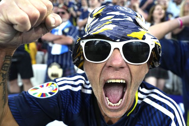 A fan cheers before the Group A match between Germany and Scotland at the Euro 2024 soccer tournament in Munich, Germany, Friday, June 14, 2024. (Photo by Ariel Schalit/AP Photo)