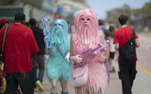 Star Wars enthusiasts wear costumes resembling what they say are “Chew's Angels” during the 2015 Comic-Con International Convention in San Diego, California July 10, 2015. (Photo by Mario Anzuoni/Reuters)