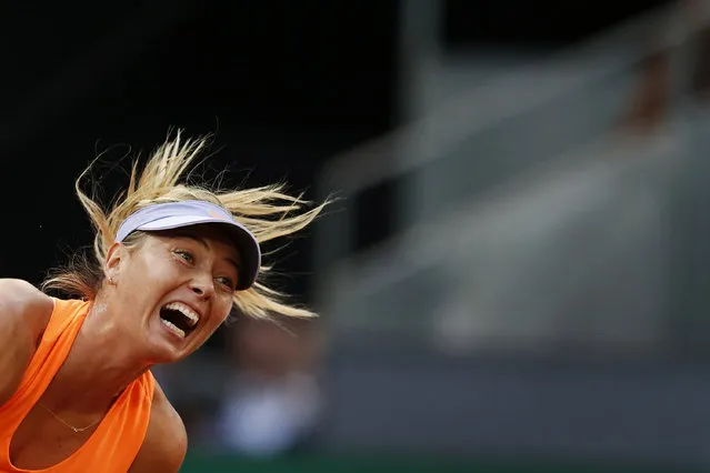 Maria Sharapova from Russia serves against Eugenie Bouchard from Canada during a Madrid Open tennis tournament match in Madrid, Spain, Monday, May 8, 2017. Bouchard won 7-5, 2-6 and 6-4. (Photo by Francisco Seco/AP Photo)