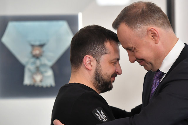 Polish President Andrzej Duda (R) awards Ukrainian President Volodymyr Zelensky with Order of the White Eagle during his visit in Warsaw, Poland, 05 April 2023. Zelensky was awarded the Order of the White Eagle in recognition of his merits in deepening relations between Poland and Ukraine, for his security activities and steadfastness in defending human rights.Bilateral relations and cooperations will top the agenda during the presidents' meeting. (Photo by Radek Pietruszka/EPA/EFE)