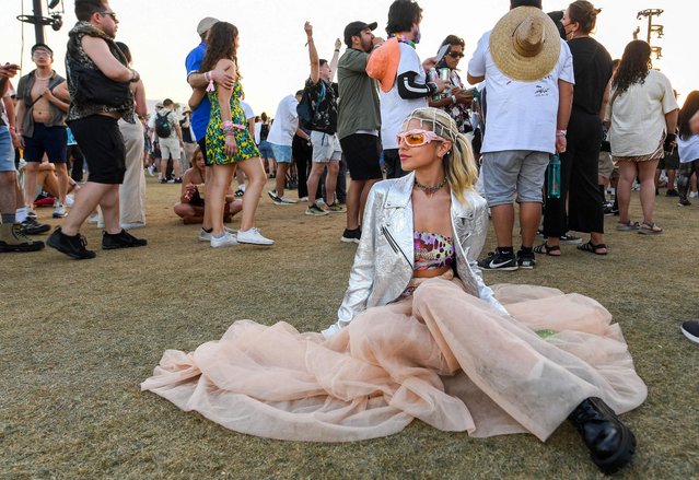 Rosalia's fan Lizzi Kapran listens to her performance during the first week-end of the Coachella Valley Music and Arts Festival, in Indio, California, on April 15, 2023. (Photo by Valerie Macon/AFP Photo)