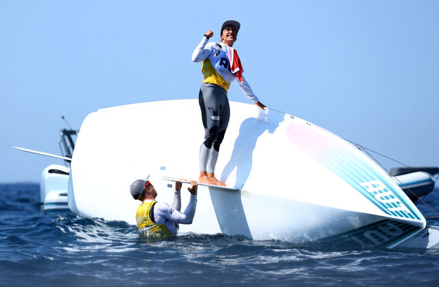 Gold medallists Austria's Lara Vadlau and Lukas Maehr celebrate after the medal race of the mixed 470 double-handed dinghy event during the Paris 2024 Olympic Games sailing competition at the Roucas-Blanc Marina in Marseille on August 8, 2024. (Photo by Lisi Niesner/Reuters)