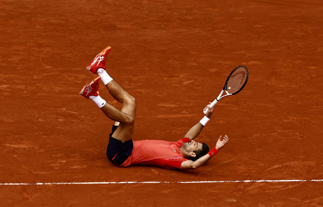 Serbia's Novak Djokovic celebrates after winning his final match against Norway's Casper Ruud at the Roland Garros stadium in Paris, France on June 11, 2023. Djokovic said winning a record 23rd men's singles Grand Slam title at the French Open was special given that it was always the toughest one to win for him. (Photo by Clodagh Kilcoyne/Reuters)