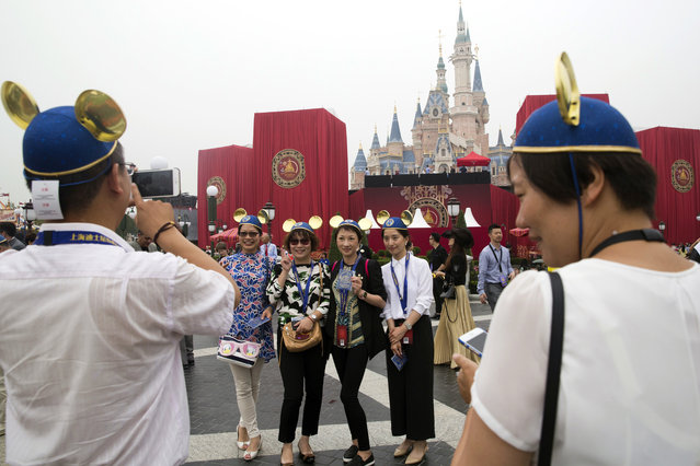Guests attend an opening ceremony for the Disney Resort in Shanghai, China, Thursday, June 16, 2016. (Photo by Ng Han Guan/AP Photo)