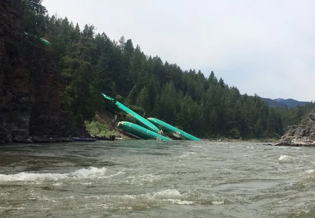Three Boeing 737 fuselages lie on an embankment on the Clark Fork River after a BNSF Railway Co train derailed Thursday near Rivulet, Montana in this picture taken July 4, 2014. A train derailment in Montana this week damaged a shipment of jetliner fuselages and other large parts on its way to Boeing Co factories in Washington state from Spirit Aerosystems, Boeing said on Saturday. (Photo by Andrew Spayth/Reuters)