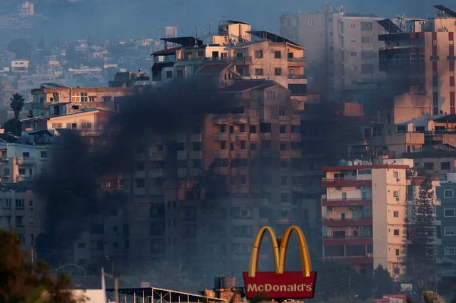 Smoke billows over southern Lebanon following an Israeli strike, amid ongoing cross-border hostilities between Hezbollah and Israeli forces, as seen from Tyre, Lebanon on September 25, 2024. (Photo by Amr Abdallah Dalsh/Reuters)