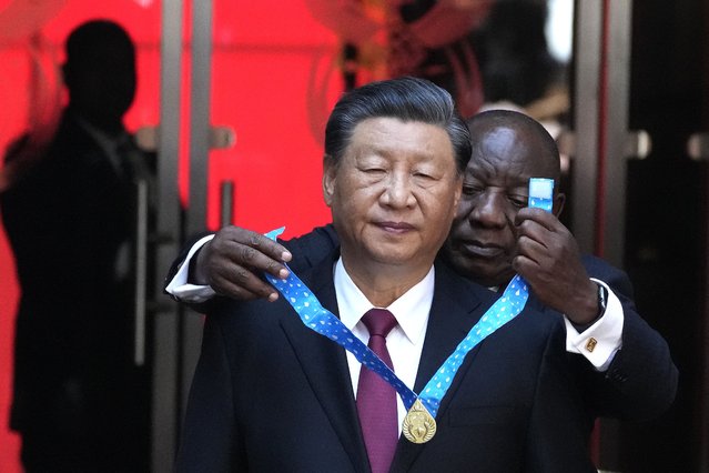 Chinese President Xi Jinping, left, receives the order of South Africa from President Cyril Ramaphosa at Union Building in Pretoria, South Africa, Tuesday, August 22, 2023. Jinping has arrived for a state visit in South Africa where the two countries are expected to strengthen ties ahead of the BRICS summit starting in Johannesburg on Tuesday. (Photo by Themba Hadebe/AP Photo)