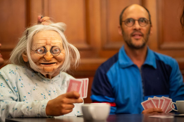 Puppet Norma and actor Sicaire Durieuxof Compagnie Chaliwaté play cards during a photocall for the show “Dimanche” for the Edinburgh International Festival 2023 at Church Hill Theatre on August 14, 2023 in Edinburgh, Scotland. (Photo by Roberto Ricciuti/Getty Images)