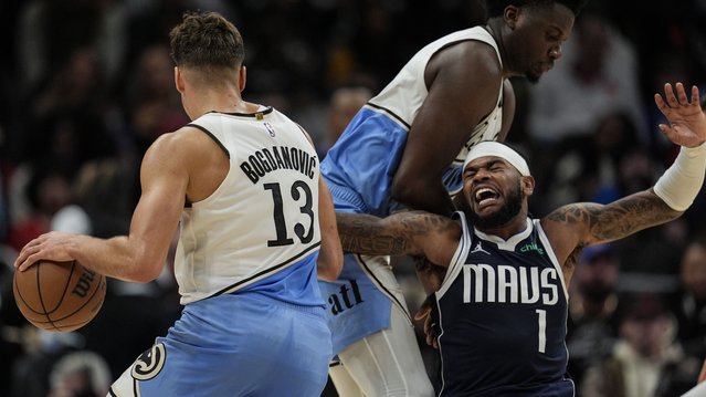 Atlanta Hawks guard Bogdan Bogdanovic (13) moves the ball against Dallas Mavericks guard Jaden Hardy (1) during the second half of an NBA basketball game, Monday, November 25, 2024, in Atlanta. (Photo by Mike Stewart/AP Photo)