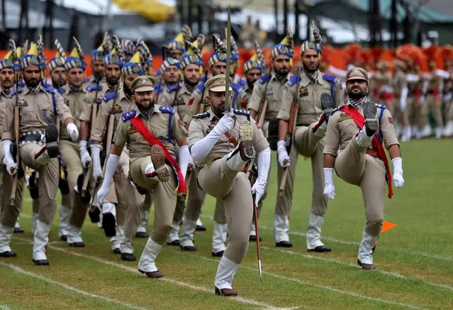 Police officers take part in a parade to celebrate India's Independence Day celebrations in Srinagar on August 15, 2022. (Photo by Danish Ismail/Reuters)