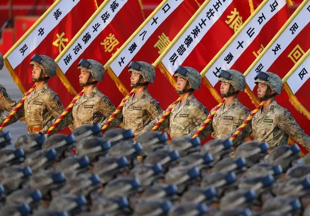 Soldiers of the People’s Liberation Army (PLA) of China stand in formation as they gather ahead of a military parade to mark the 70th anniversary of the end of World War Two, in Beijing, China, September 3, 2015. (Photo by Reuters/Stringer)