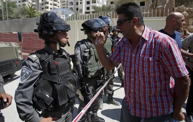 A Palestinian argues with Israeli border police during a protest against what organizers say is land confiscation by Israel to make way for the Israeli barrier in the occupied West Bank city of Beit Jala, near Bethlehem September 6, 2015. (Photo by Mussa Qawasma/Reuters)