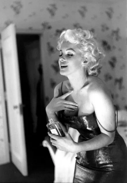 NEW YORK - MARCH 24: Actress Marilyn Monroe gets ready to go see the play “Cat On A Hot Tin Roof” playfully applying her make up and Chanel No. 5 Perfume on March 24, 1955 at the Ambassador Hotel in New York City, New York. (Photo by Michael Ochs Archives)
