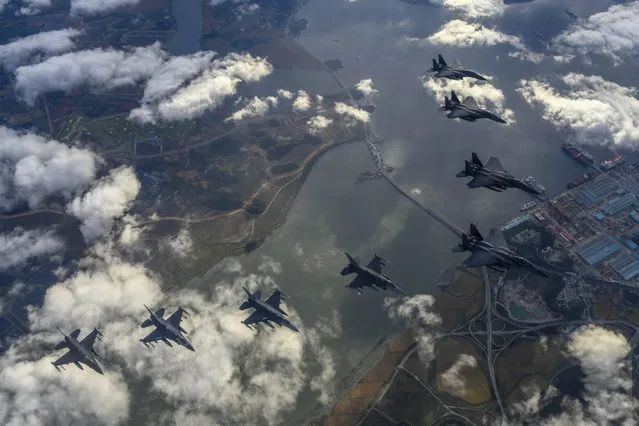In this handout image released by the South Korean Defense Ministry, South Korean Air Force F-15Ks and U.S. Air Force F-16 fighter jets fly over the Korean Peninsula in response to North Korea's intermediate-range ballistic missile (IRBM) launch earlier in the day, on October 04, 2022 at an undisclosed location.North Korea fired an intermediate-range ballistic missile (IRBM) over Japan on Tuesday in its first launch of an IRBM in eight months, according to South Korea’s military. (Photo by South Korean Defense Ministry via Getty Images)