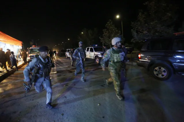 Afghan security forces rush to respond to a complex Taliban attack on the campus of the American University in the Afghan capital Kabul on Wednesday, August 24, 2016. “We are trying to assess the situation”, President Mark English told The Associated Press. (Photo by Rahmat Gul/AP Photo)