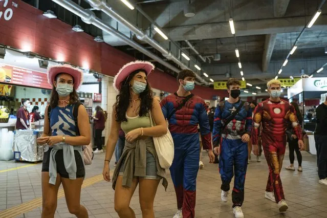 Attendees in costumes arrive at the Hong Kong Stadium ahead of the first day of the Hong Kong Sevens rugby tournament in Hong Kong, Friday, November 4, 2022. (Photo by Anthony Kwan/AP Photo)