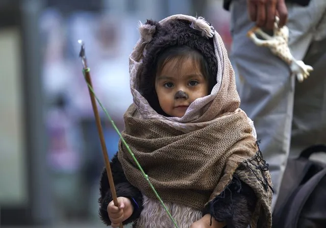 A child dressed as an Ewok character participates in a Star Wars parade in Mexico City, Saturday, October 15, 2022. (Photo by Marco Ugarte/AP Photo)