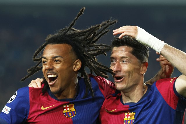Barcelona's Robert Lewandowski, right, celebrates with Barcelona's Jules Kounde after scoring his side's second goal during the Champions League quarterfinals first leg soccer match between Barcelona and Borussia Dortmund, at the Lluis Companys Olympic stadium in Barcelona, Spain, Wednesday, April 9, 2025. (Photo by Joan Monfort/AP Photo)