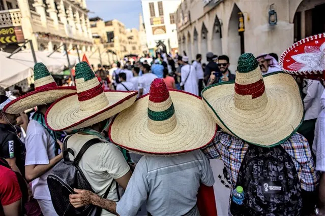 Fans of Mexico pose for photo at the Souq Waqif market during FIFA World Cup 2022 in Doha, Qatar, 30 November 2022. Mexico will face Saudi Arabia in their group C match of the FIFA World Cup 2022 on 30 November. (Photo by Martin Divisek/EPA/EFE/Rex Features/Shutterstock)