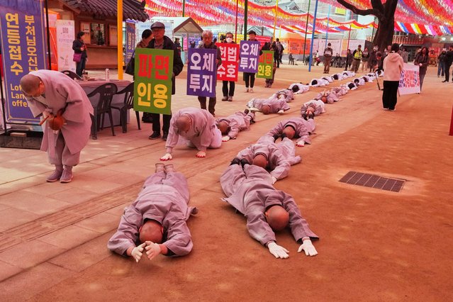 South Korean Buddhist monks and members of civic groups prostrate every three steps as they march to the Constitutional Court to demand the dismissal of impeached President Yoon Suk Yeol in Seoul, South Korea, Wednesday, April 2, 2025. (Photo by Lee Jin-man/AP Photo)