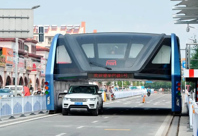 The citizens can participate in the prospective test process with the period of about 1 year of the “Flying Airbus” in Qinhuangdao, Hebei, China on 5th September 2016. The megabus is  22 metres long, 7.8 metres wide and 4.8 metres high, with a space of about 2.1 metres to let cars pass below. (Photo by TopPhoto/Alamy Live News)