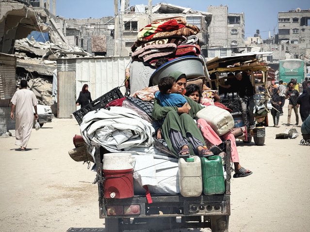 Hundreds of Palestinians flee to the western parts of the Khan Yunis city, taking their belongings with them after the Israeli army warned that it would launch an offensive against the center of Khan Yunis in southern Gaza on June 13, 2025. (Photo by Abdallah F.s. Alattar/Anadolu via Getty Images)