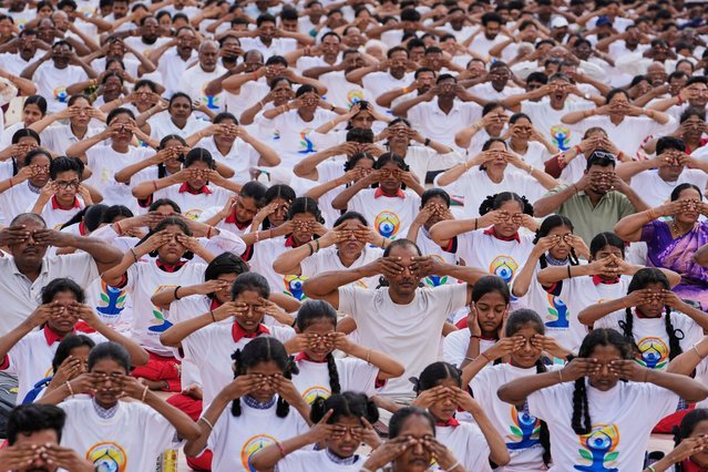 People practice yoga on the eve of International Day of Yoga at Lal Bahadur stadium in Hyderabad, India, Friday, June 20, 2025. (Photo by Mahesh Kumar A./AP Photo)