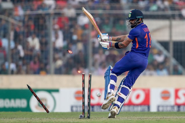 India's Virat Kohli is bowled by Bangladesh's Ebadot Hossain during the second one day international cricket match between Bangladesh and India in Dhaka, Bangladesh, Wednesday, December 7, 2022. (Photo by Surjeet Yadav/AP Photo)