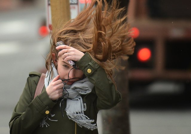 A pedestrian faces high winds in Washington, USA on March 2, 2018. (Photo by Astrid Riecken/The Washington Post)