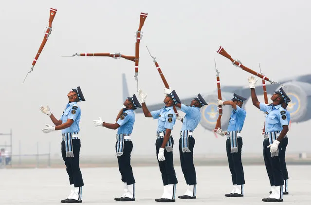 Indian Air Force soldiers toss their rifles as they perform during the full-dress rehearsal for Indian Air Force Day at the Hindon air force station on the outskirts of New Delhi, India, October 6, 2016. (Photo by Adnan Abidi/Reuters)