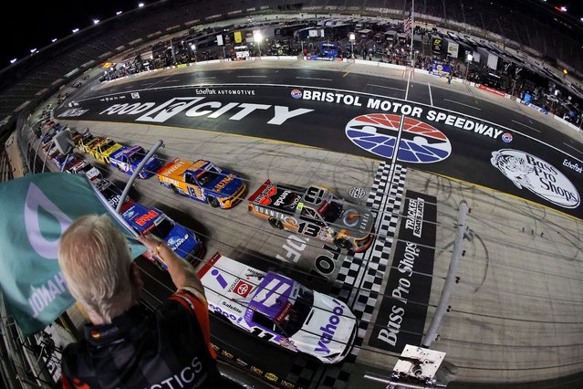 Jake Garcia, driver of the #13 Quanta Services Ford, leads the field to the green flag to start the NASCAR Craftsman Truck Series UNOH 200 presented by Ohio Logistics at Bristol Motor Speedway on September 11, 2025 in Bristol, Tennessee. (Photo by Jonathan Bachman/Getty Images)