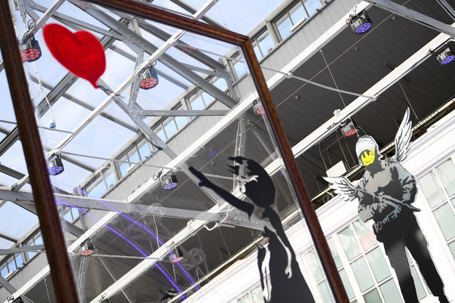 “Girl with Balloon” during a preview of the “Banksy Limitless Exhibition” on September 24, 2025 in London, England. Banksy Limitless transforms street art into an immersive gallery experience. For a limited time only, step inside hundreds of works by the world's most elusive artist. (Photo by Joe Maher/Getty Images)