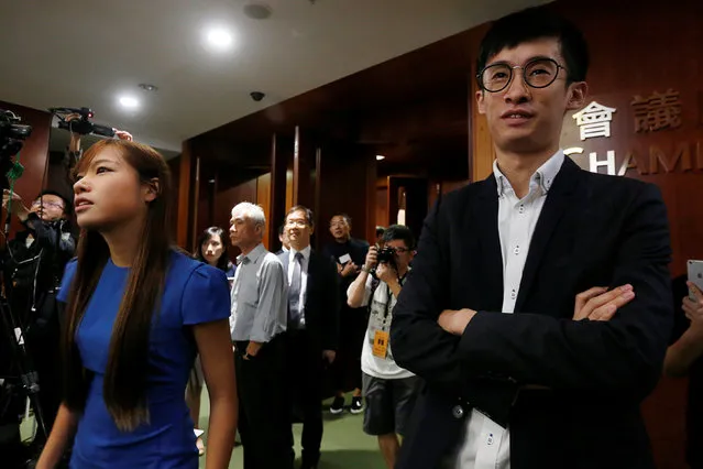 Activists Baggio Leung (R) and Yau Wai-ching (L) stand outside the chamber after pro-Beijing lawmakers staged a walk-out to stall their swearing-in at the Legislative Council in Hong Kong, China October 19, 2016. (Photo by Bobby Yip/Reuters)
