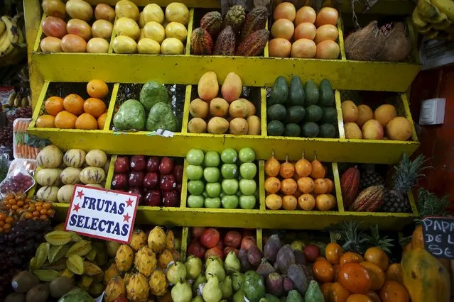 Fruits are displayed for sale at a stand at a a market in Lima's Surquillo district, October 23, 2015. The sign reads, "selected fruits". (Photo by Mariana Bazo/Reuters)