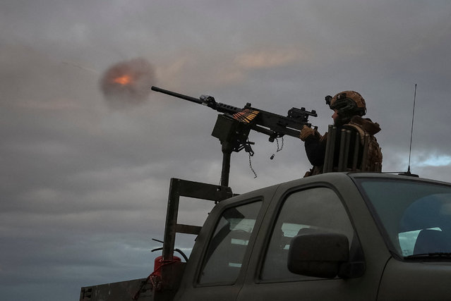 A serviceman from an anti-drone mobile air defence unit of the 38th Separate Marine Brigade of the Ukrainian Armed Forces fires a M2 Browning machine gun during combat shift on the front line, amid Russia's attack on Ukraine, in the Donetsk region, Ukraine on October 20, 2025. (Photo by Anatolii Stepanov/Reuters)