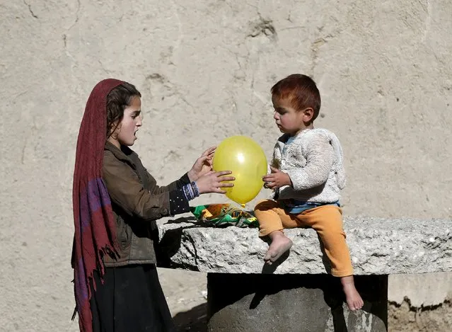 Afghan children play with a balloon outside their house in Kabul, Afghanistan November 16, 2015. (Photo by Omar Sobhani/Reuters)