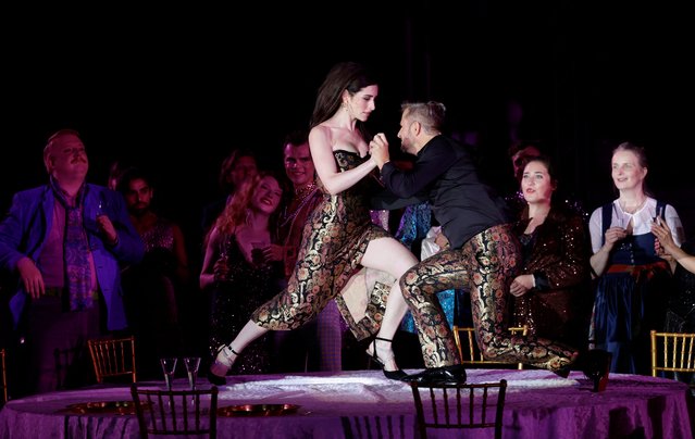 Actors Deleila Piasko as Buhlschaft and Philipp Hochmair as Jedermann perform on stage during a dress rehearsal of Hugo von Hofmannsthal's drama “Jedermann” (Everyman) at Salzburg cultural festival in Salzburg, Austria, on July 17, 2024. (Photo by Leonhard Foeger/Reuters)