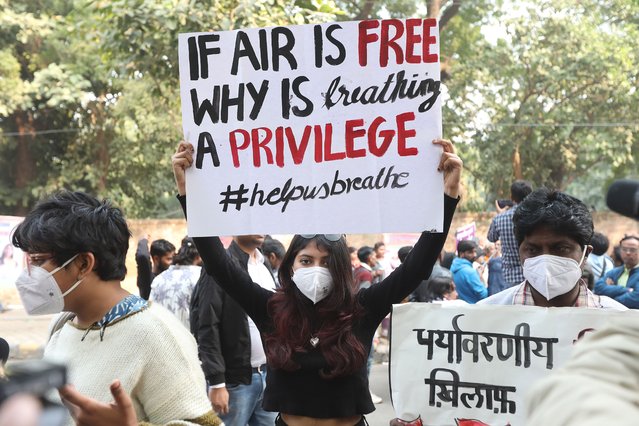 Indian protesters hold banners and shout slogans demanding the government to take action to curb pollution in New Delhi, India, 18 November 2025. Residents of the Indian capital are struggling with air pollution as Delhi’s air quality has remained in the 'very poor' category for five consecutive days, with an overall AQI of 341 at 6 a.m. Indian time. (Photo by Harish Tyagi/EPA)
