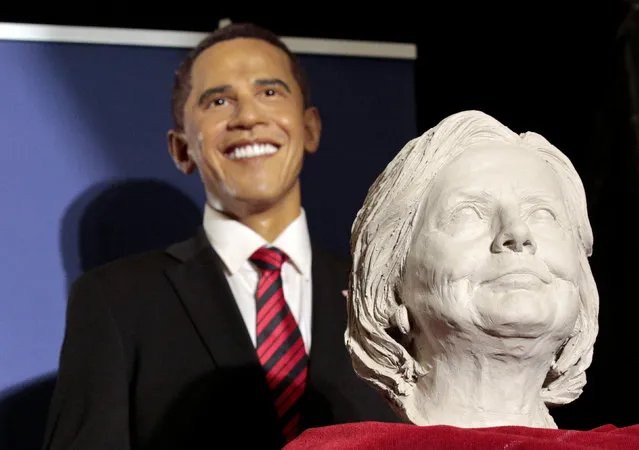 A clay bust of U.S. presidential candidate Hillary Clinton is seen in front of a figure of U.S. President Barack Obama at the Wax Museum in Madrid, Spain, November 4, 2016. (Photo by Andrea Comas/Reuters)