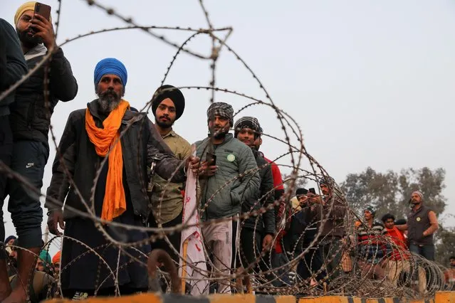 Farmers prepare for a rally against the newly passed farm laws ahead of Republic Day at Singhu border near New Delhi, India, January 25, 2021. (Photo by Anushree Fadnavis/Reuters)