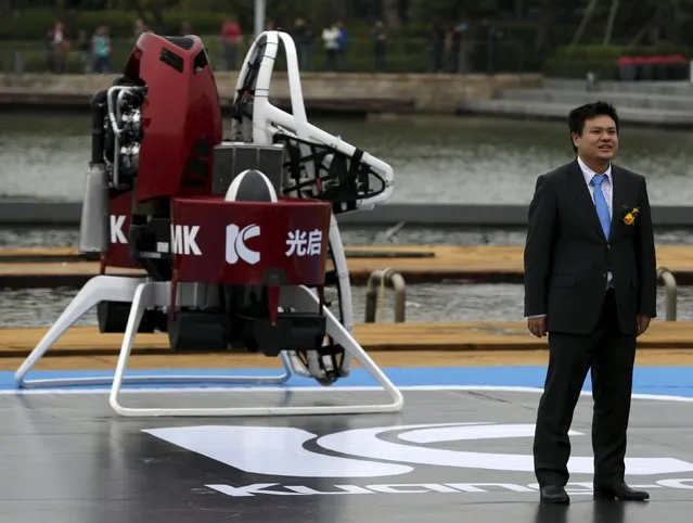 KuangChi Science Ltd Chairman and Executive Director Liu Ruopeng stands in front of a Martin Jetpack, made by New Zealand-based Martin Aircraft, during a demonstration at a water park in Shenzhen, China December 6, 2015. (Photo by Bobby Yip/Reuters)