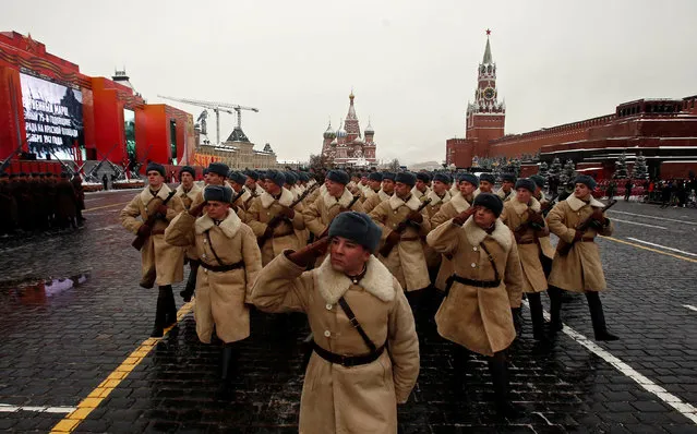 Servicemen dressed in historical uniforms march before a military parade marking the anniversary of the 1941 parade when Soviet soldiers marched towards the front lines of World War Two, in Red Square in Moscow, Russia November 7, 2016. (Photo by Maxim Shemetov/Reuters)