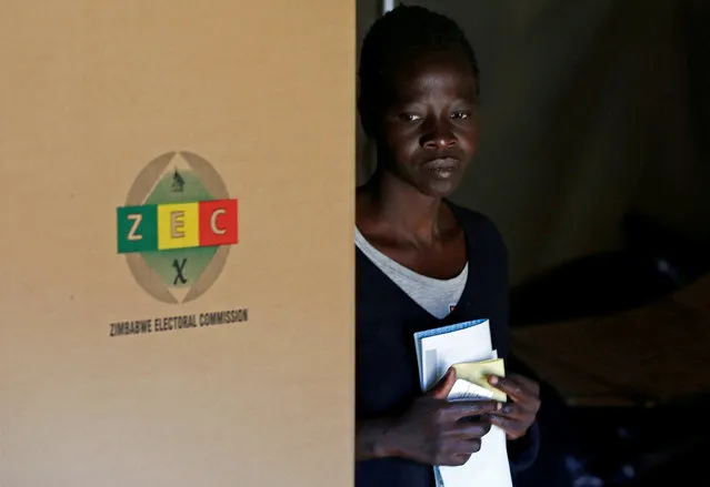A Zimbabwean voter arrives to cast her ballot in the country's general elections in Harare, Zimbabwe, July 30, 2018. (Photo by Siphiwe Sibeko/Reuters)