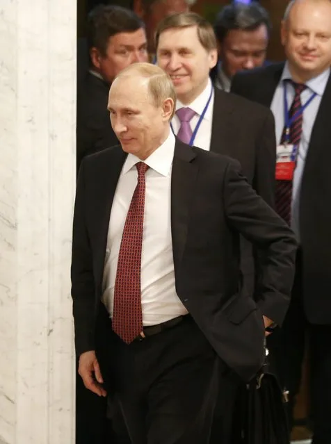 Russia's President Vladimir Putin (front) walks as he attends a peace summit to resolve the Ukrainian crisis in Minsk, February 12, 2015. (Photo by Vasily Fedosenko/Reuters)